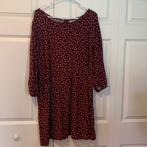 Burgundy print dress. Has a back zipper and gathered slightly in the back